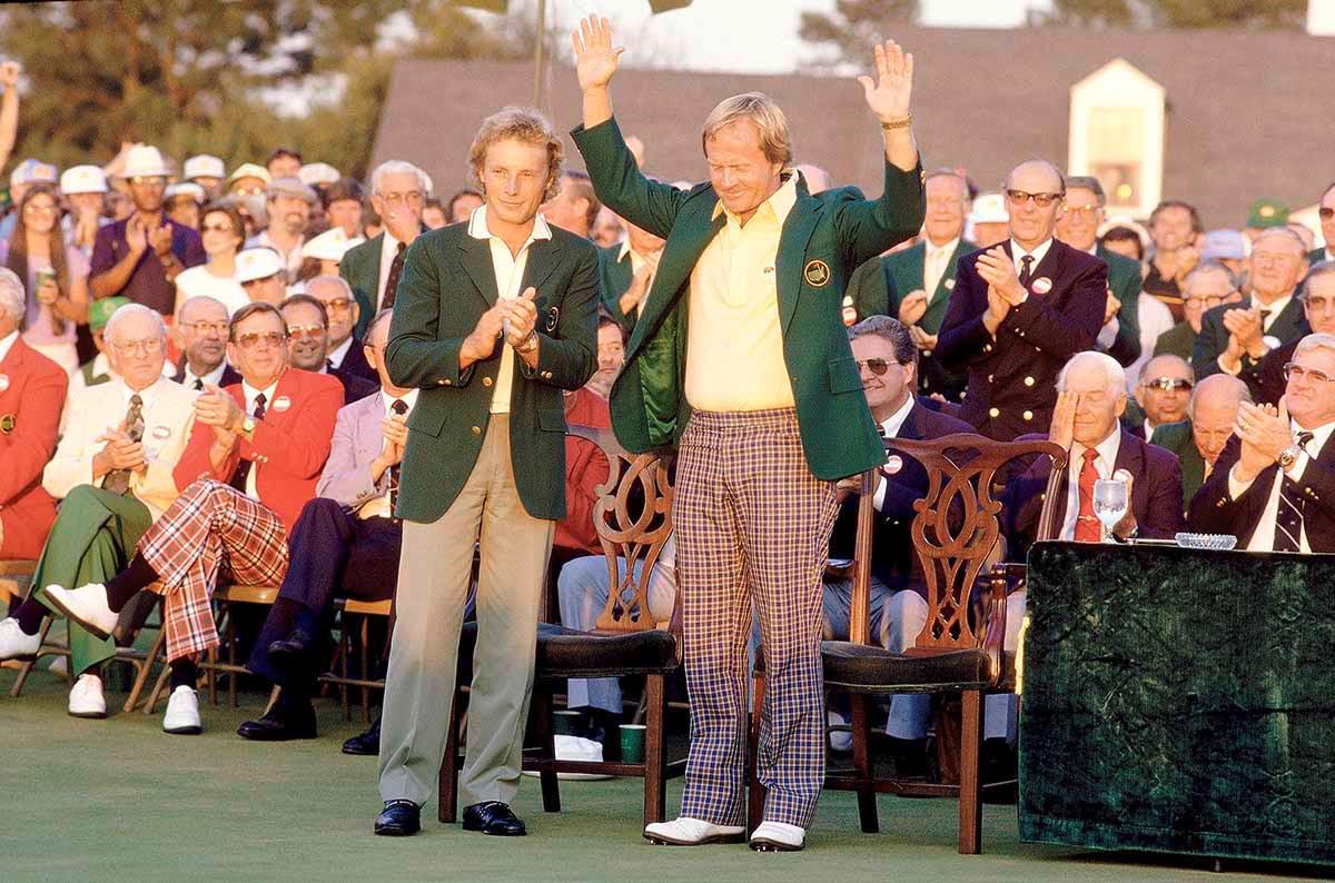 Bernhard Langer presents Jack Nicklaus with a Green Jacket for winning The Masters